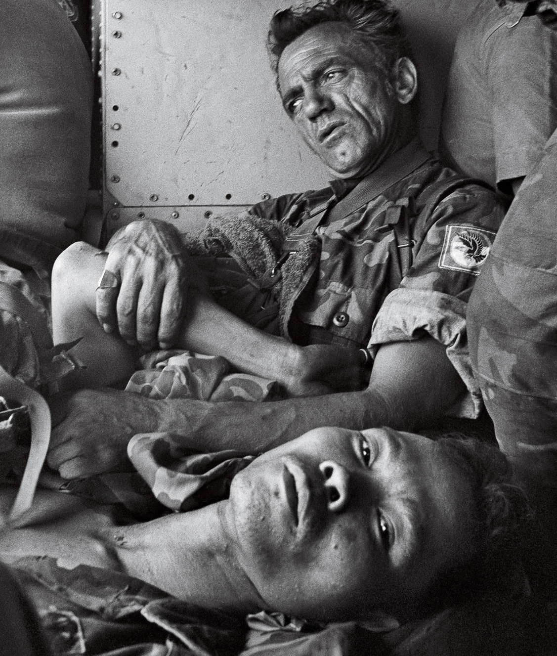 A wounded American and a wounded South Vietnamese soldier comfort each other - photo 5