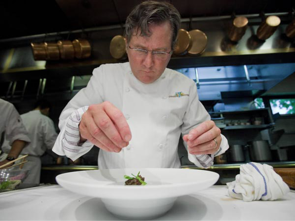 Charlie Trotter garnishes a dish at his Armitage Avenue restaurant Phil Vettel - photo 3