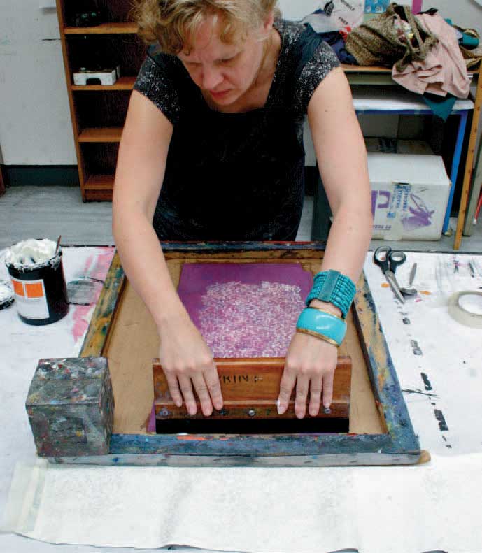 Esther Smith printing leather pieces on a sampling table This chapter aims to - photo 6