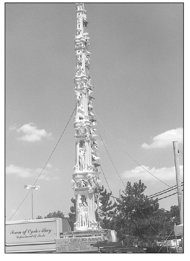 The Giglio Feast features a remarkable five-story structure with a statue of - photo 2