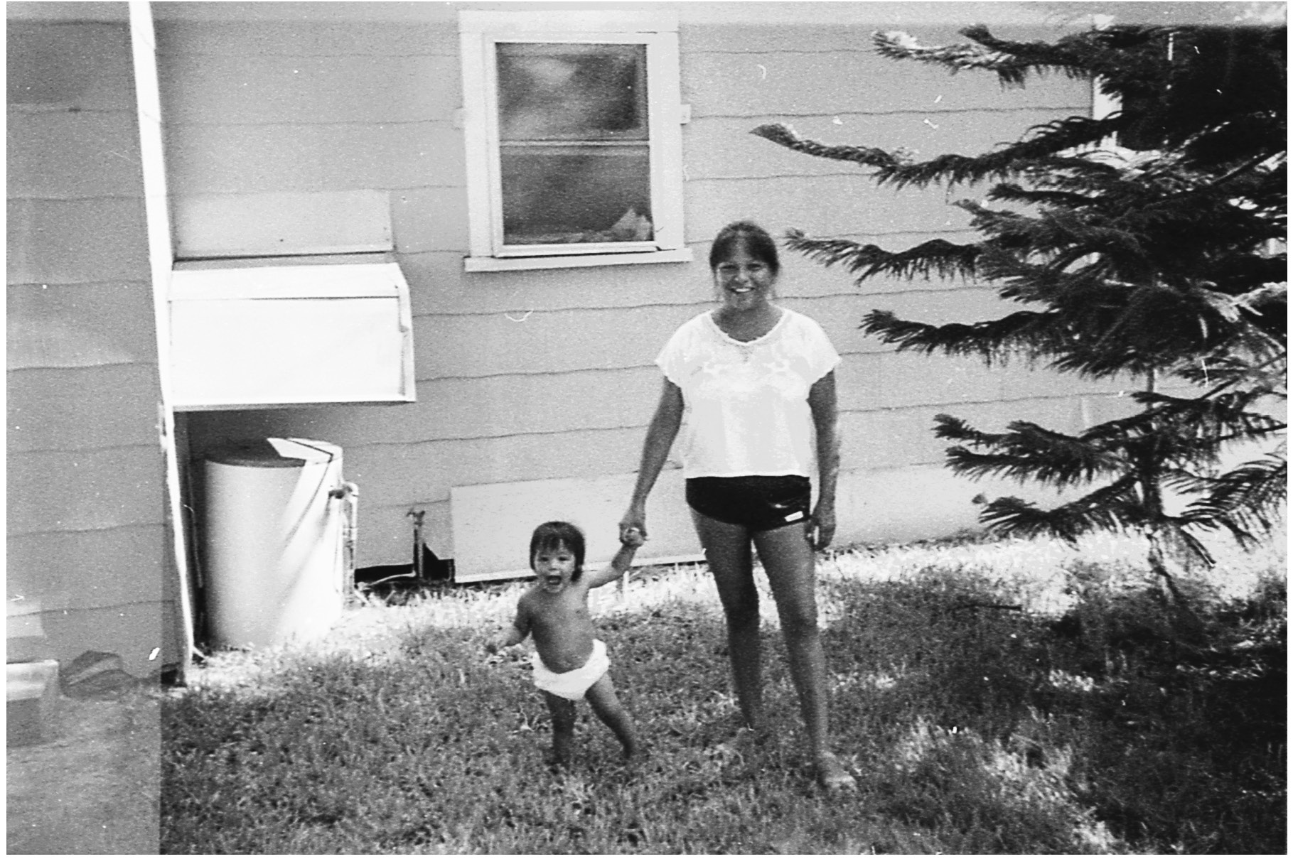 TITLE Laureen Tweety Lee holds her daughters hand behind their apartment in - photo 4