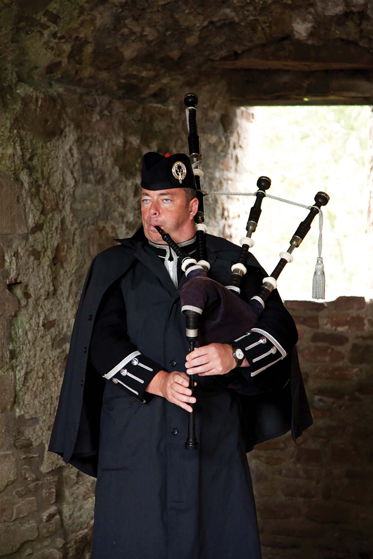 A bagpiper in full regalia plays Scotlands national instrument THE BEST OF - photo 12