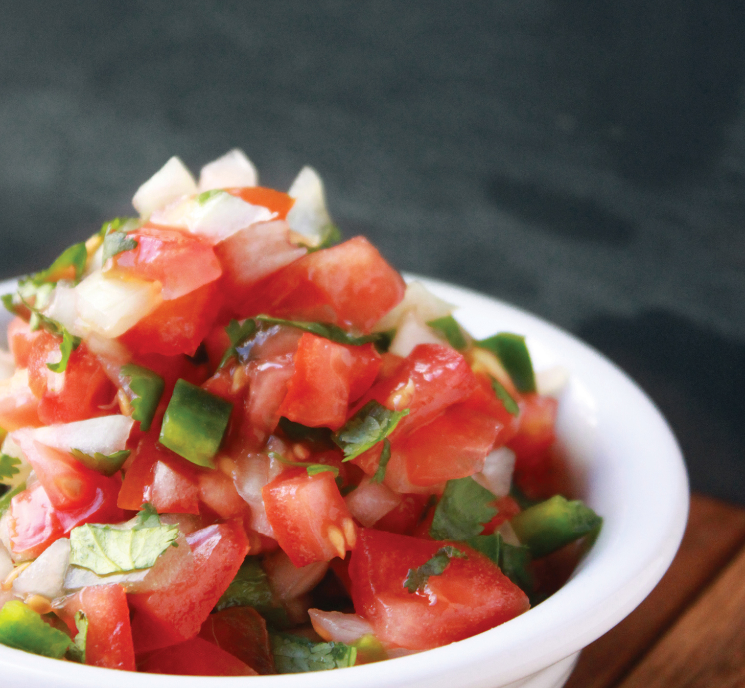 Chop 2 large tomatoes and onion then toss all into a bowl Chop a jalapeo and - photo 17