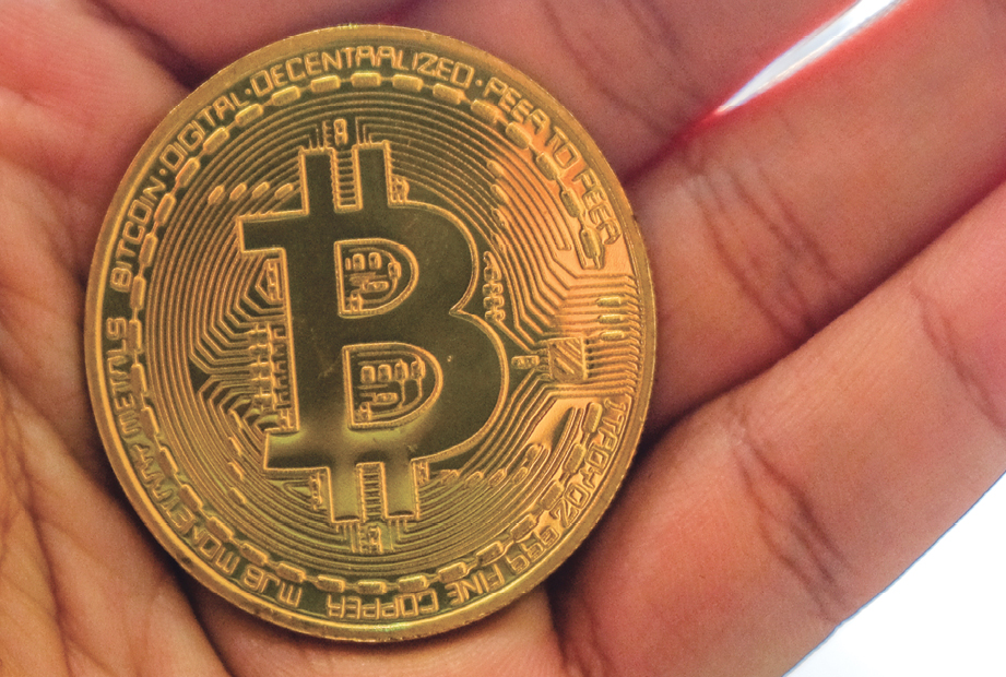 Although Bitcoin is a form of digital currency some physical coins have been - photo 3