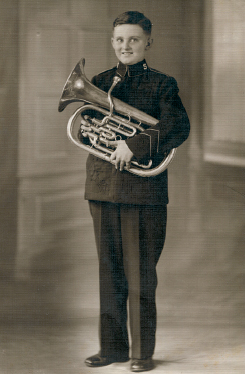 Dudley proudly shows off the euphonium he played in the Salvation Army band - photo 6