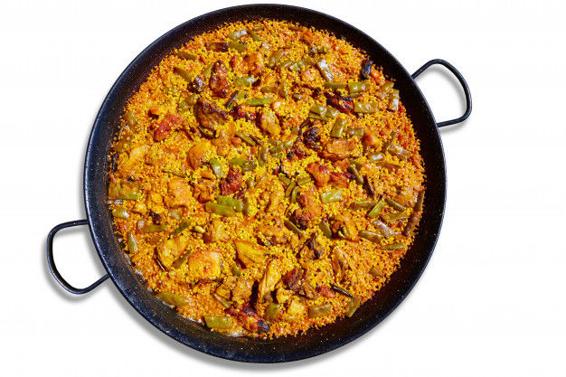 Mixing chicken and rabbit meat into your regular Valencian paella gets you the - photo 7