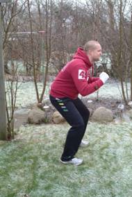 Squats with front-kick When you come up from the squat do a front-kick with - photo 2