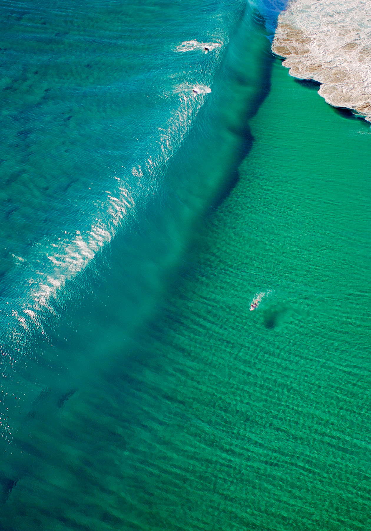 A surfer gets in position to take advantage of a peaking wave Notice the - photo 8