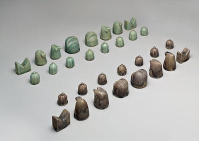- a 12 th -century carved stone chess set shows the indistinct pieces used by - photo 2