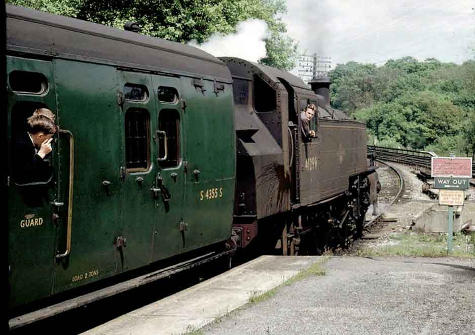 Boy seems to have problem with smuts in the eye as 2-6-2 tank No 41299 pulls - photo 1