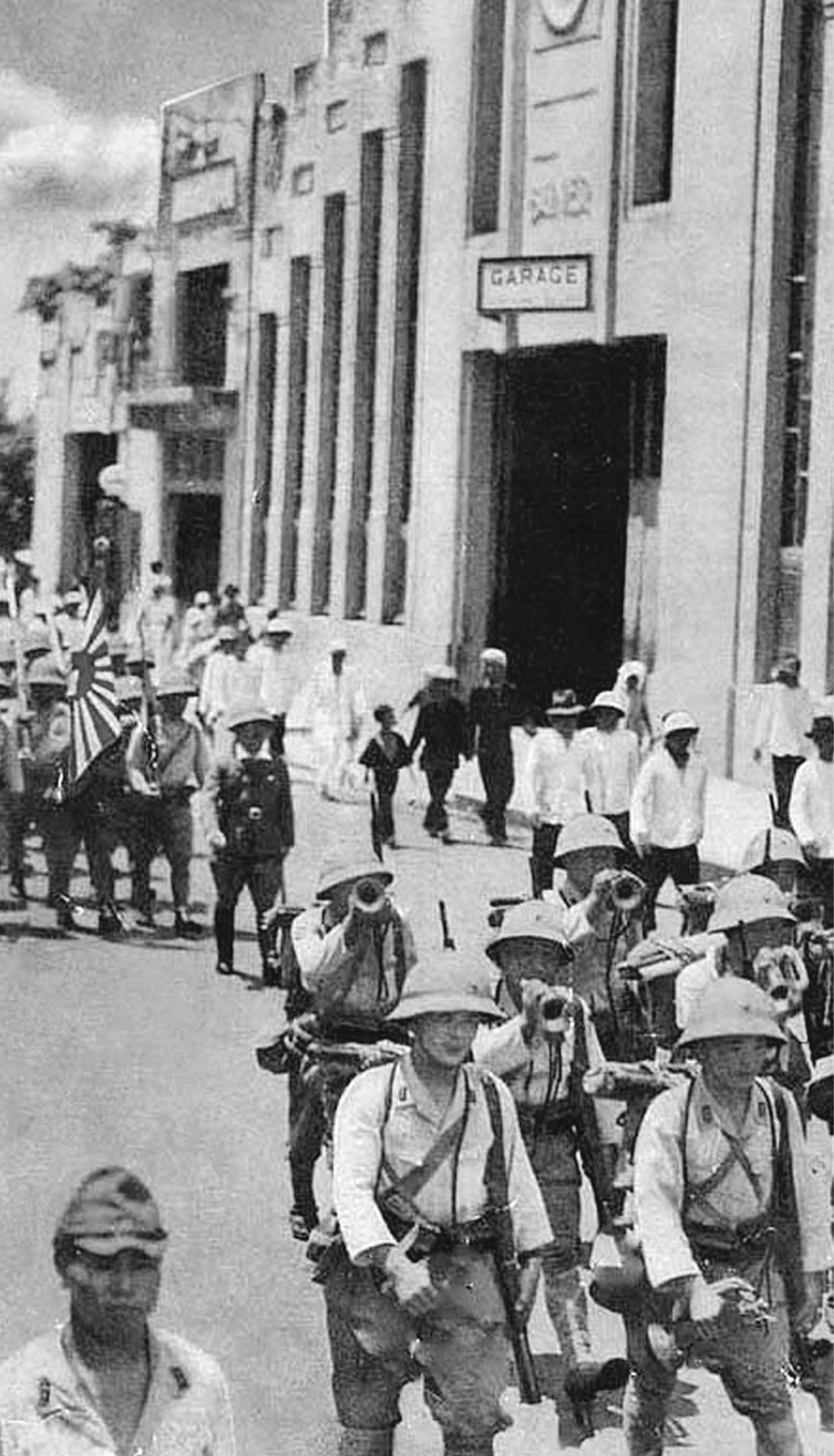 Japanese troops enter Saigon during World War II n Double-tap image to - photo 9