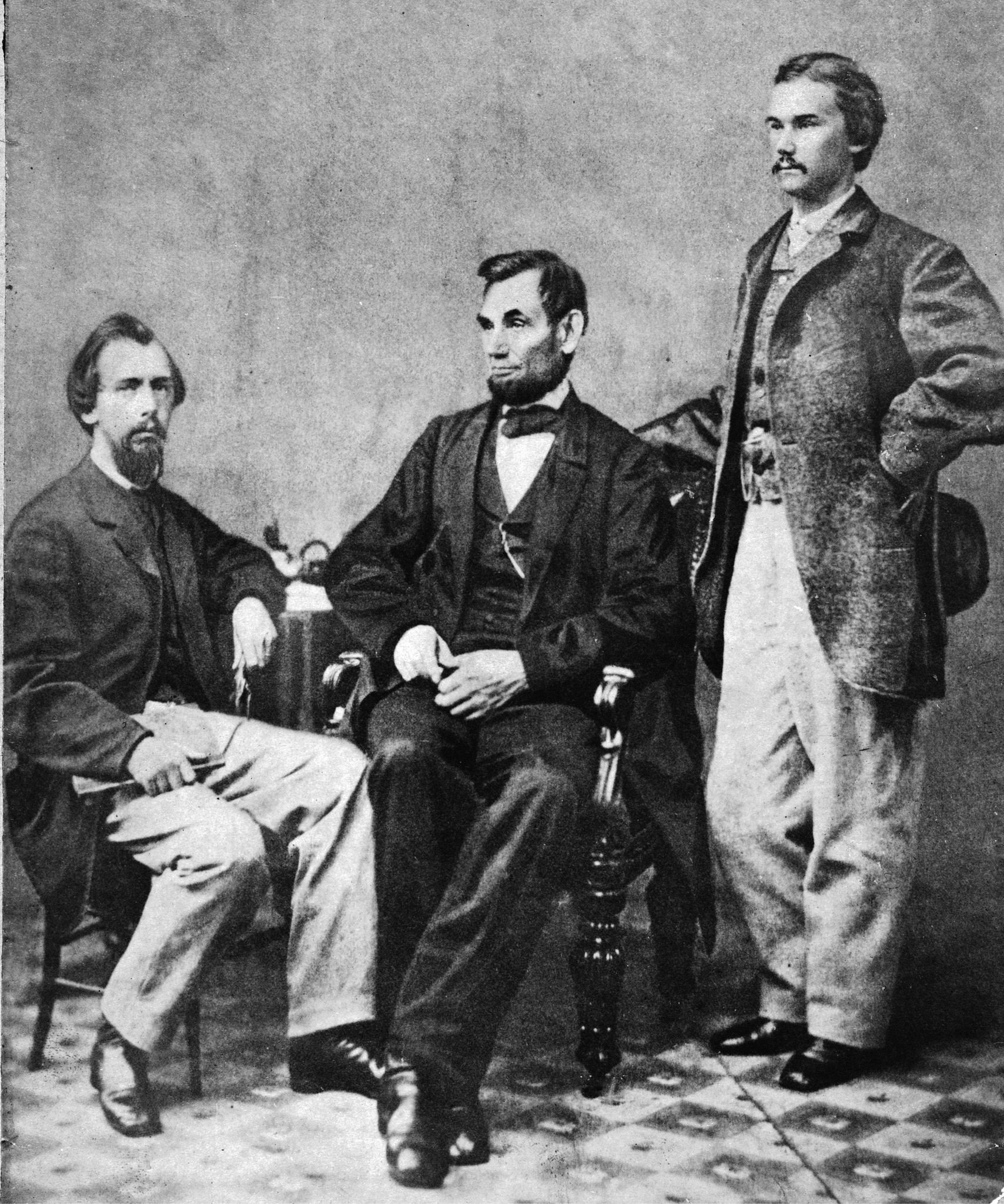 Lincoln sits between his private secretaries John G Nicolay seated and John - photo 3