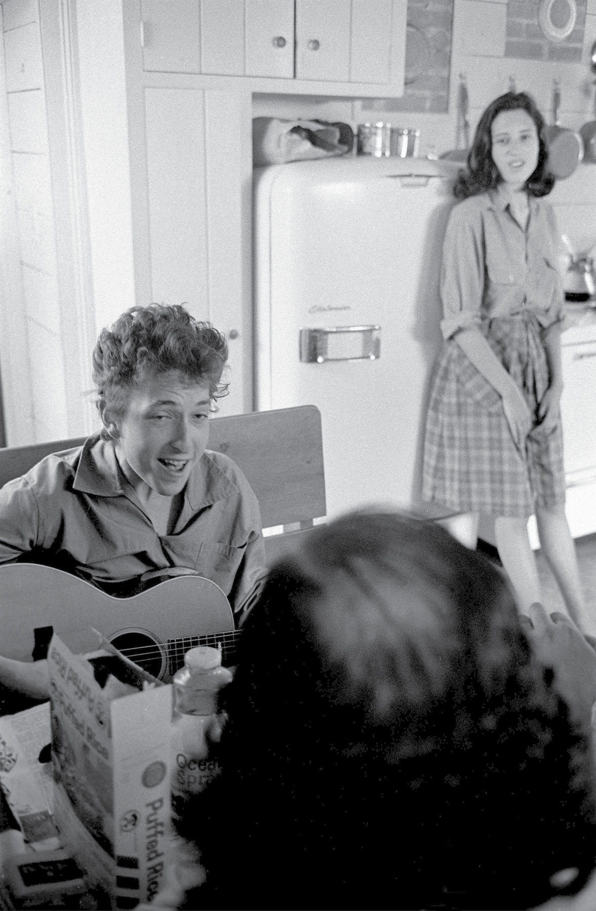 Dylan sings to Sally Grossman and the back of Allen Ginsbergs head in his - photo 14