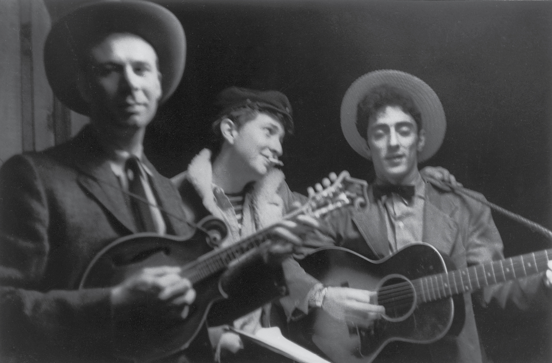 A smokin Bob Dylan busks along with fellow folkies Ralph Rinzler left and - photo 5