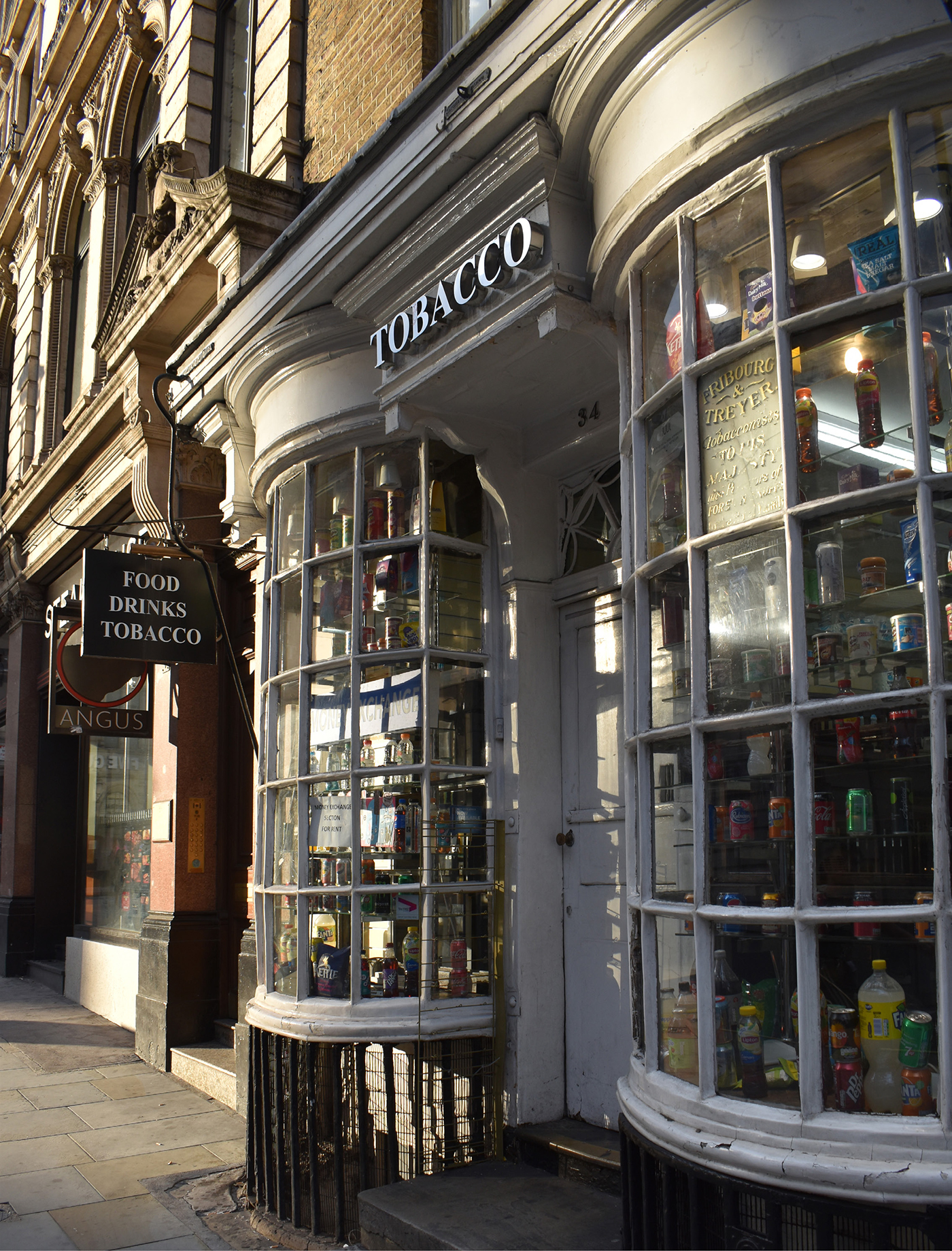 Eighteenth-century storefront with characteristic bow-fronted oriel windows in - photo 5