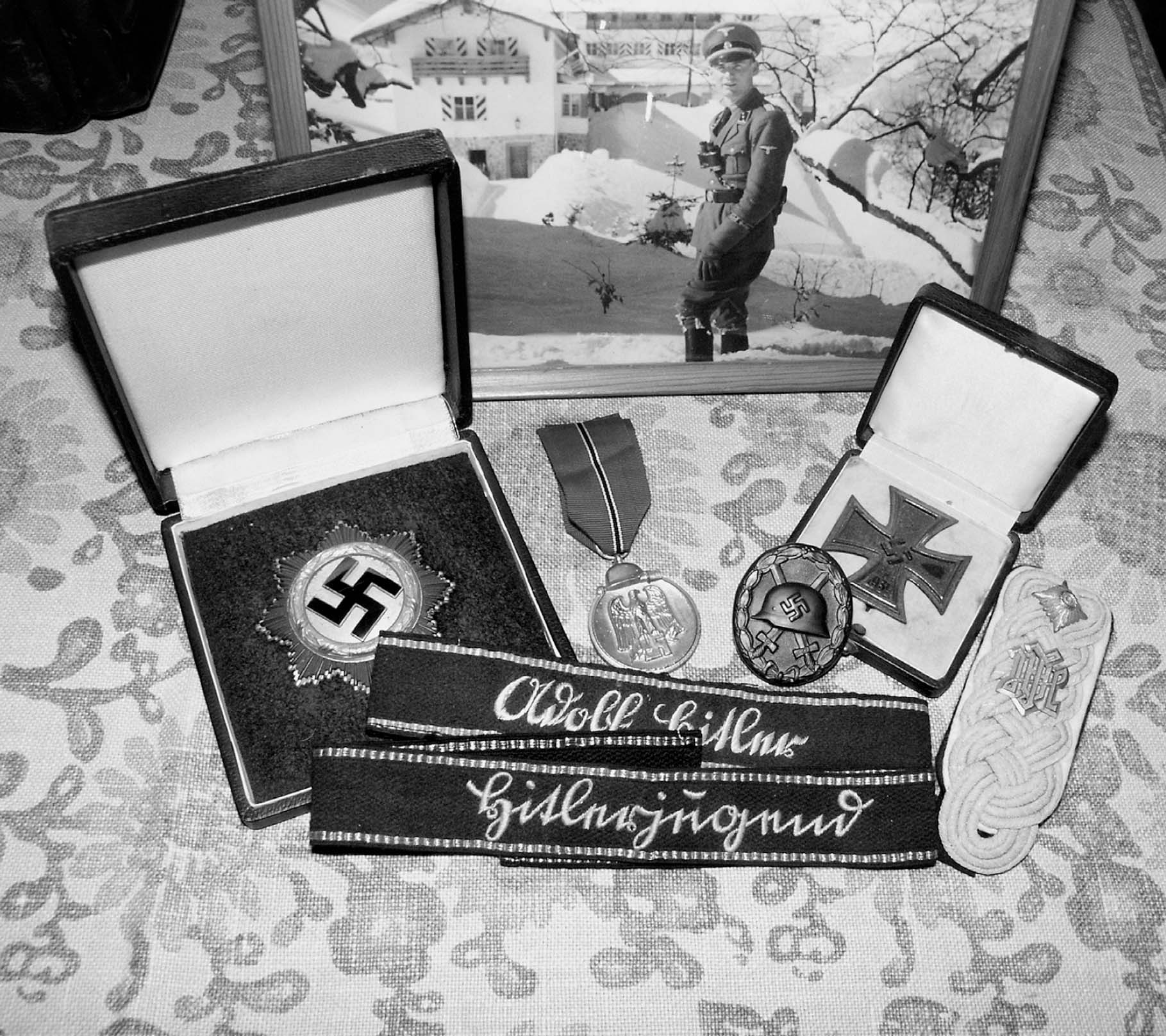 Hubert Meyers memorabilia in front of a photograph of him as a junior officer - photo 4