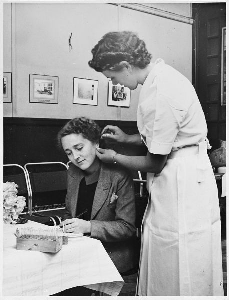 01 Photograph of a donor having a sample taken for a blood grouping test at - photo 3