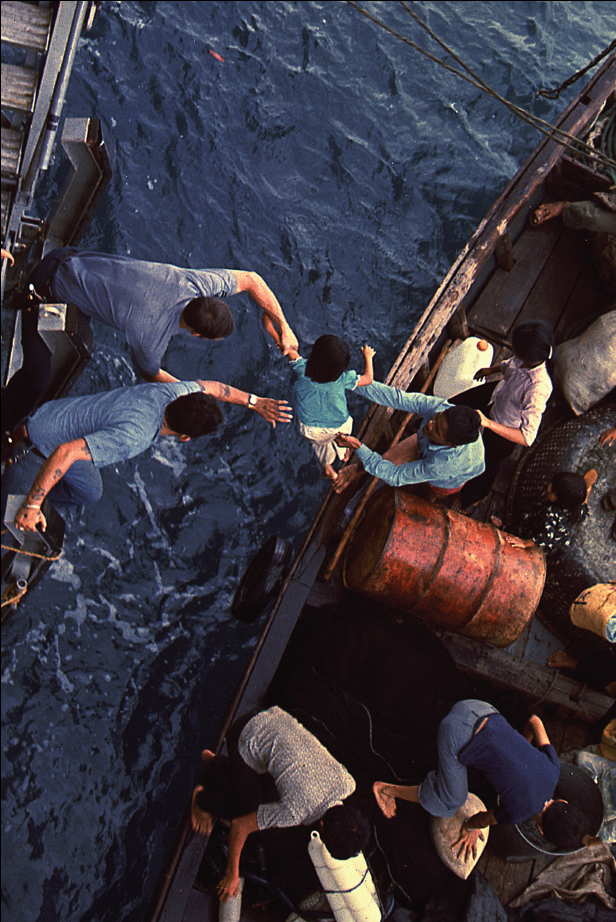 South China Sea Crewmen of the amphibious cargo ship USS Durham LKA-114 take - photo 2