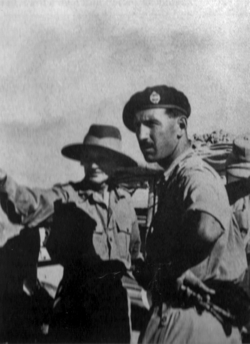 Monty wearing a slouch hat talks to Lt Col Jim Hutton near Medinine not far - photo 3