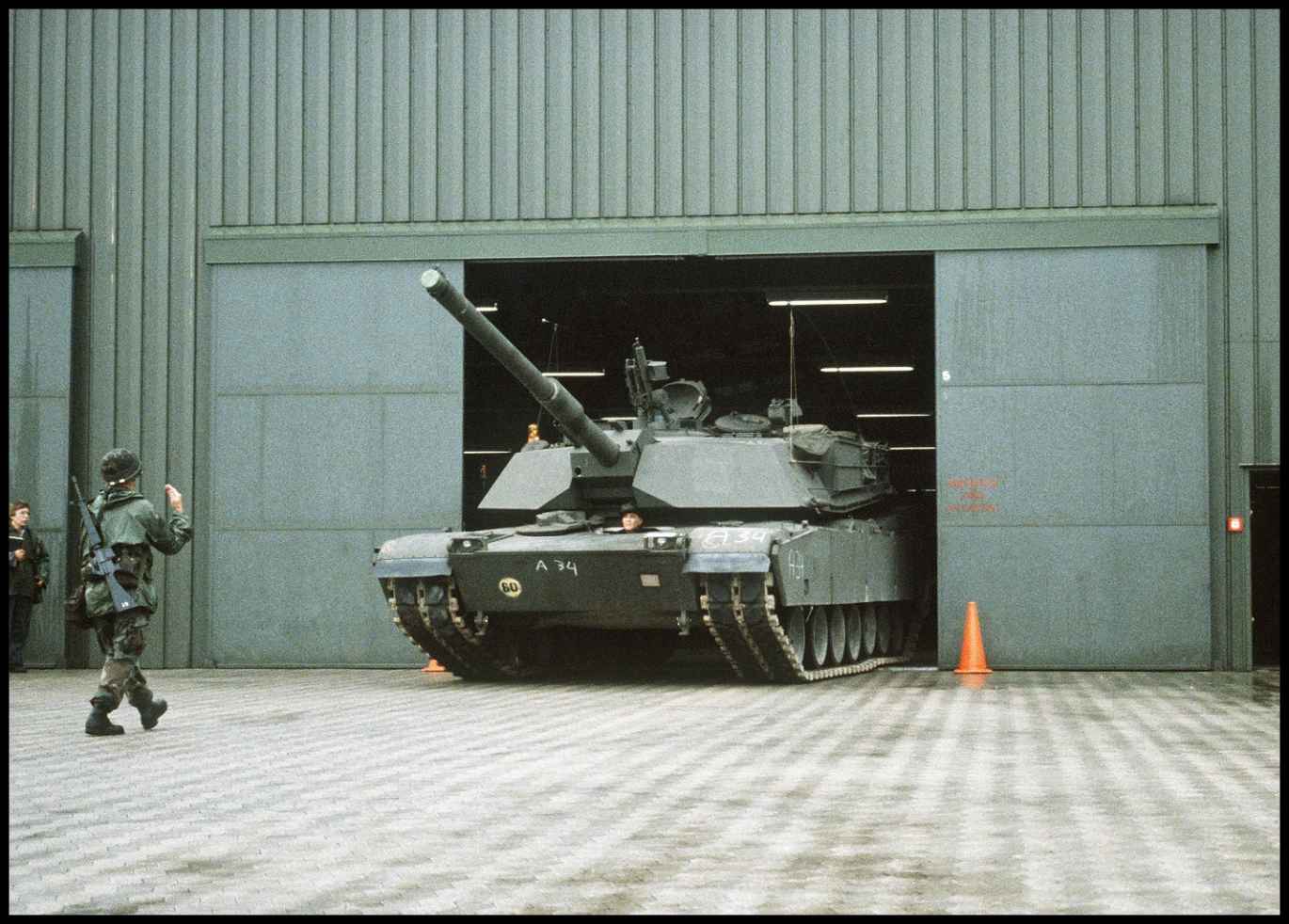 August 15 1984 An M1 Abrams main battle tank is guided out of a warehouse by - photo 9