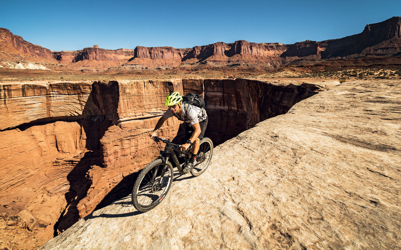 Close to the edge on the White Rim Trail in the Canyonlands National Park - photo 3