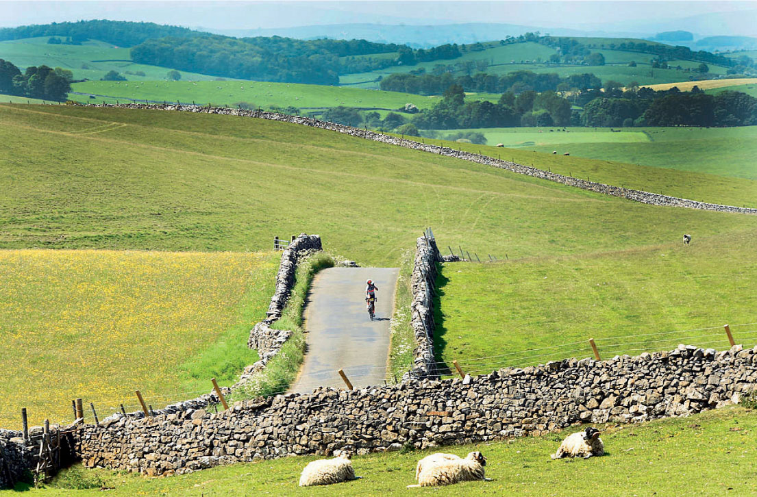 A cyclist on the Great North Trail passing through the Yorkshire Dales The - photo 8