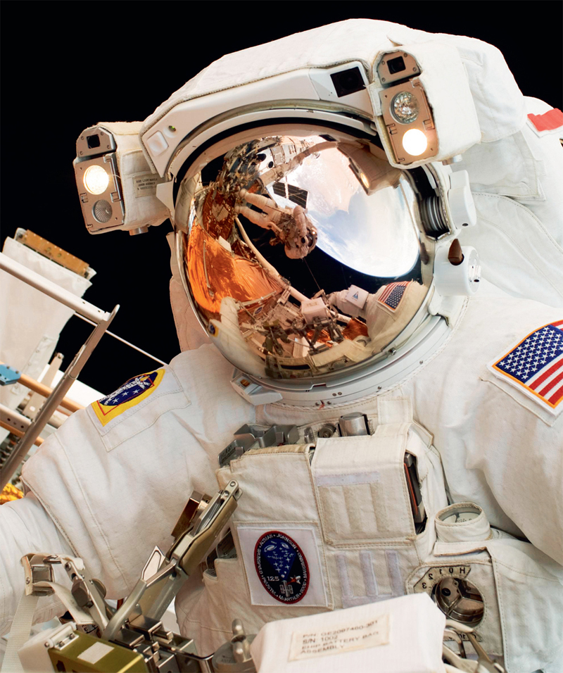 NASA Hubble repair astronaut John Grunsfelds mirrored helmet visor reflects - photo 5