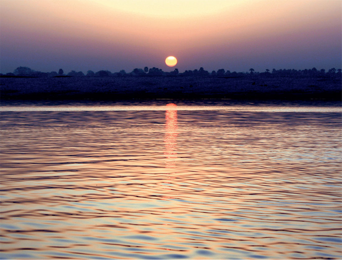 In Varanasi the sun rises over the Ganges River T he Ganges River begins at - photo 11