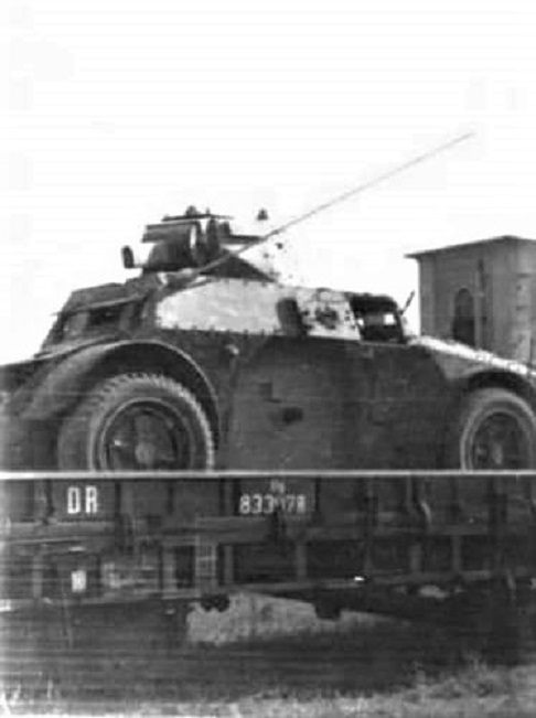 An AB41 armored car of the Motorcycle Armored Corps loaded on a railway - photo 1