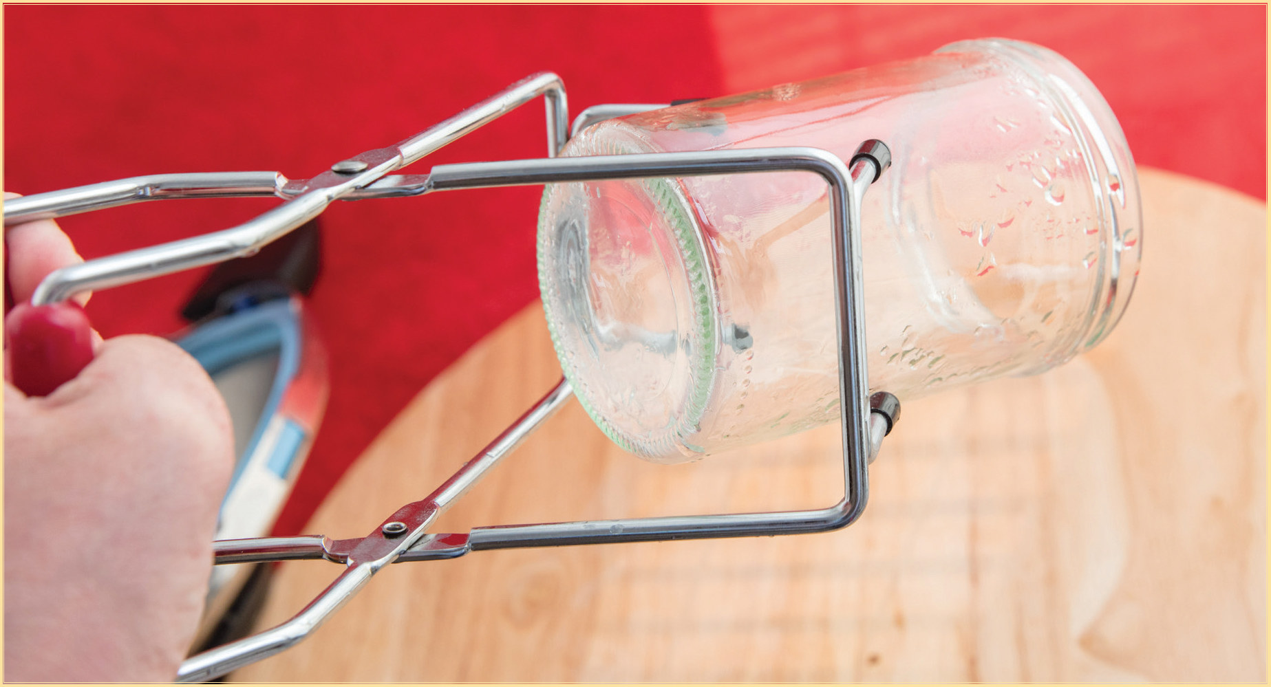 A jar lifter makes removing the jars from the boiling water much easier and - photo 9