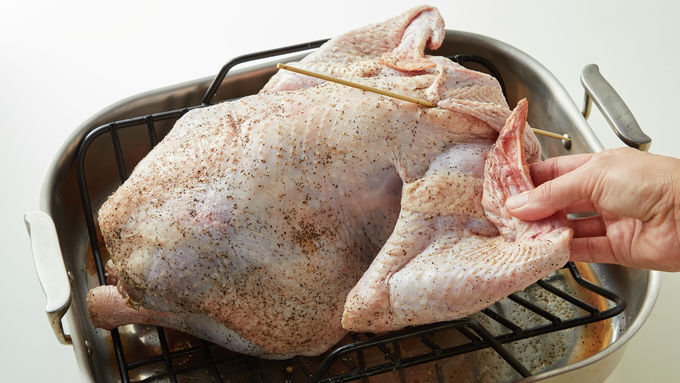 Place turkey back side down on rack in roasting pan In small bowl mix 4 - photo 5