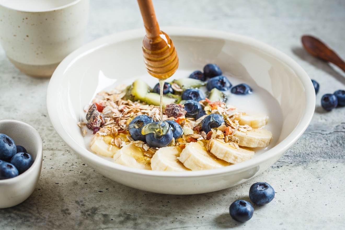 This is a delectable banana breakfast bowl made with bananas fresh berries and - photo 7