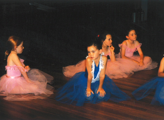 Taking part in a ballet recital at age seven Posing for a photo at our - photo 2