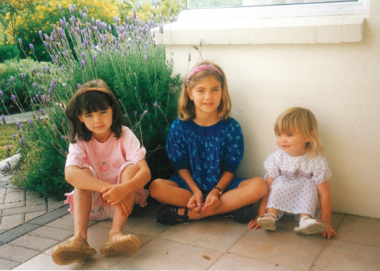 Posing for a photo at our family home in Albany with my sisters Abby centre - photo 3