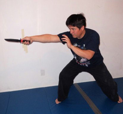 The thrust with the knife in the forward grip also called a fencing grip - photo 2