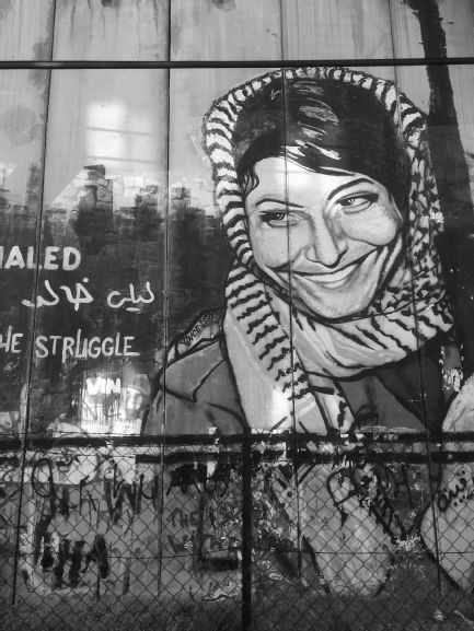 Figure 01 Mural of Leila Khaled on the separation barrierracial segregation - photo 1