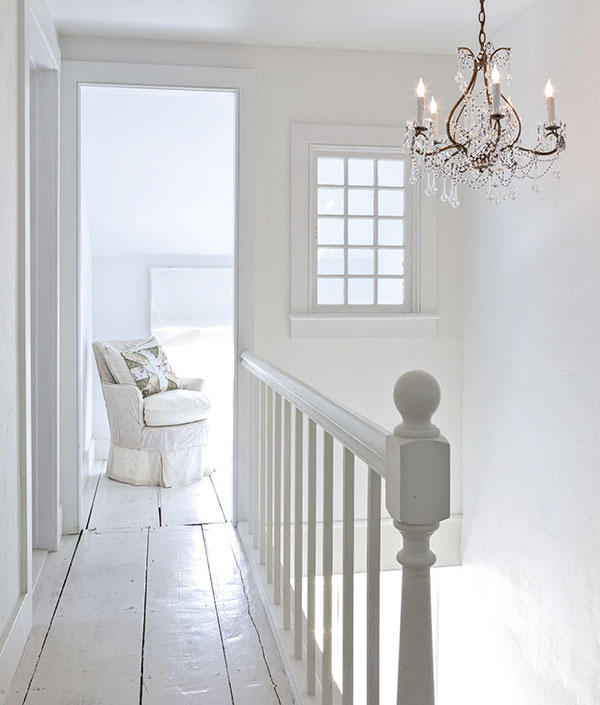 Gleaming whites and mixed materials give this minimalist landing its harmonious - photo 11