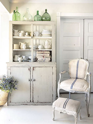 Pairing a chair upholstered in antique grain sack with a simple hutch in a dove - photo 16