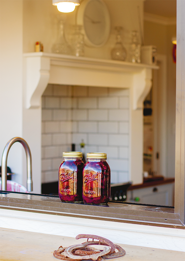 My kitchen window adorned with freshly bottled fruit and a collection of - photo 10