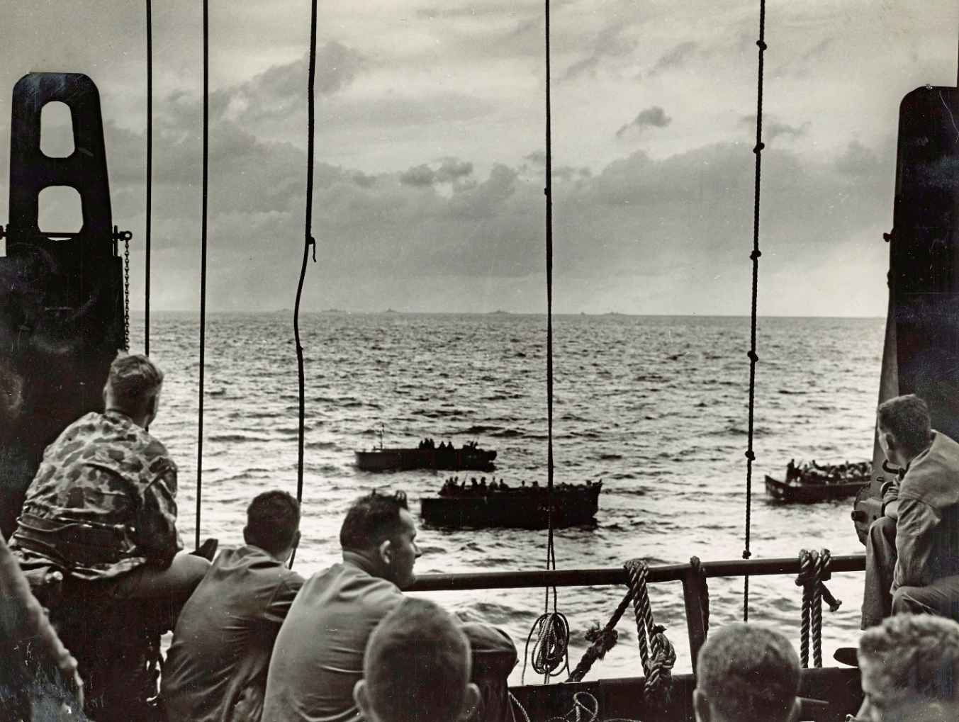 Little suspecting the hell that awaits them US Marines wait aboard a Coast - photo 3