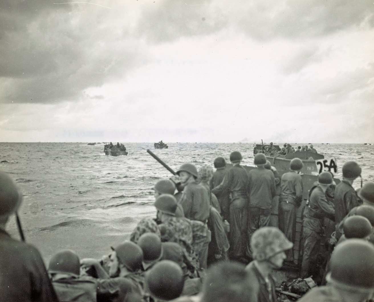 Marines in the first wave of the landing force US Coast Guardsmen at - photo 5