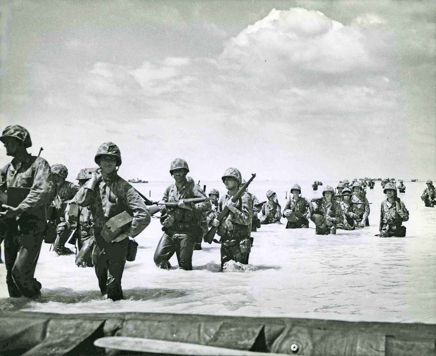 Despite enemy fire Marines wade through the surf off Tarawa Island Landing - photo 7