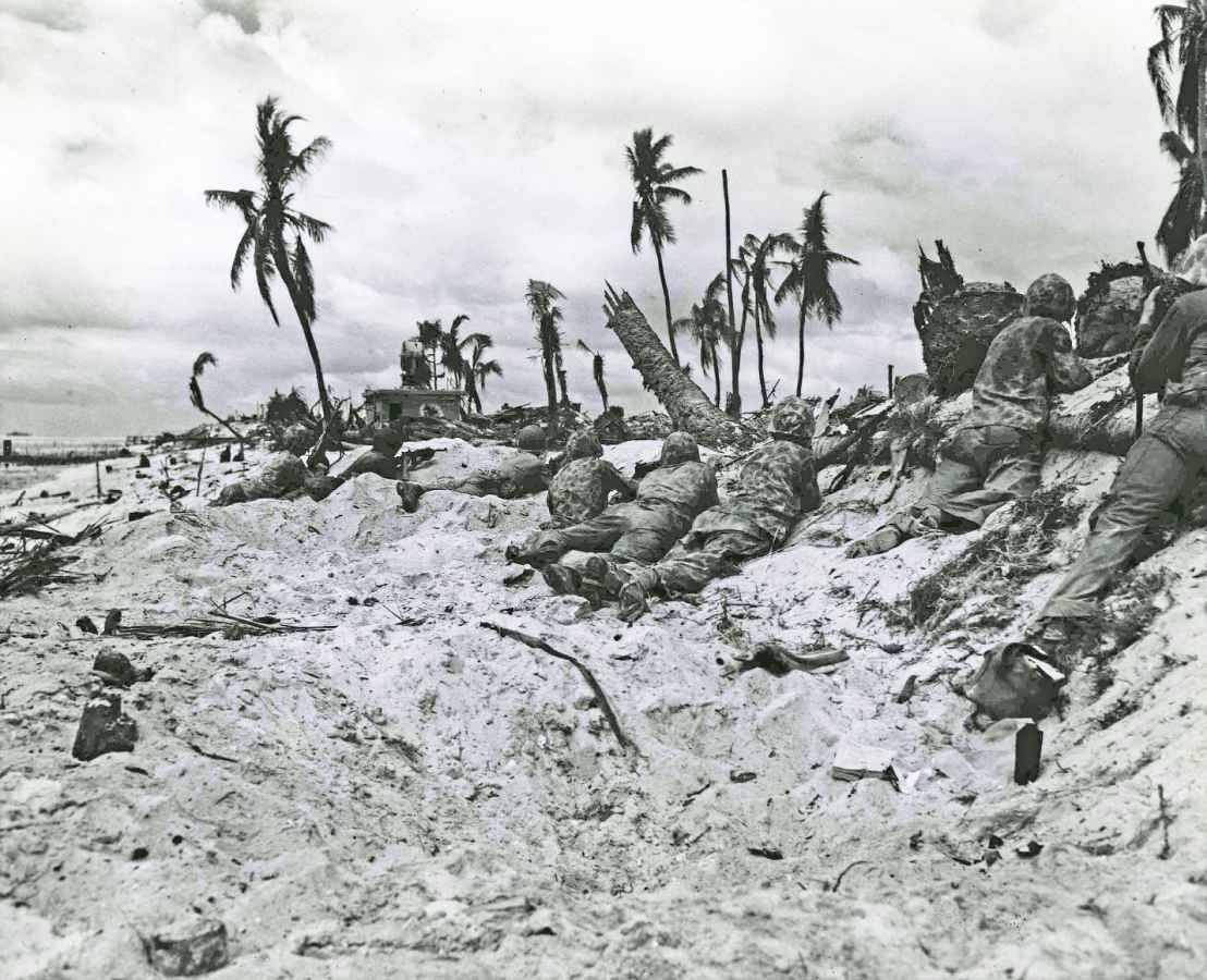 Marines on a Tarawa beach take their positions to attack the airport there - photo 12