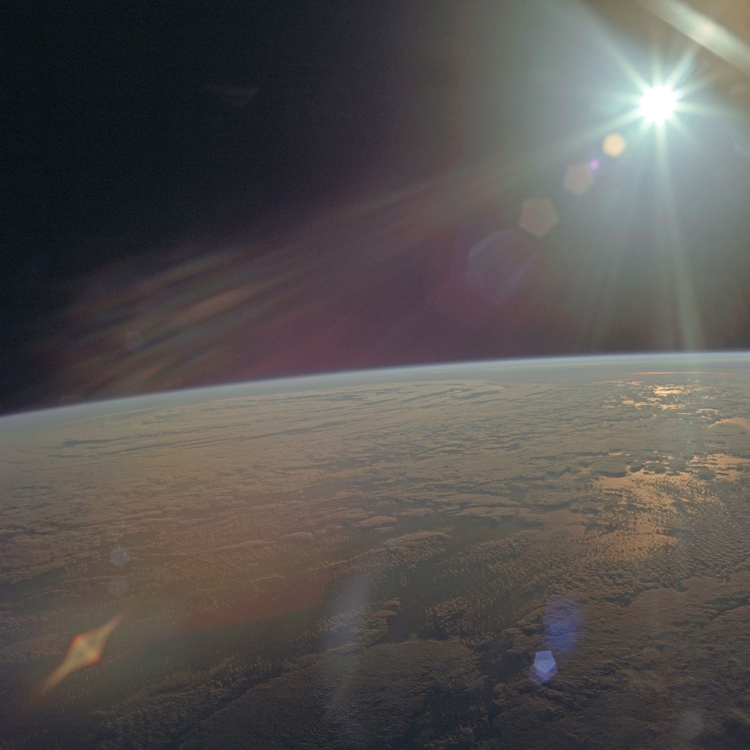 Earth limb with clouds Glare of Sun visible above the Earths horizon Image - photo 15