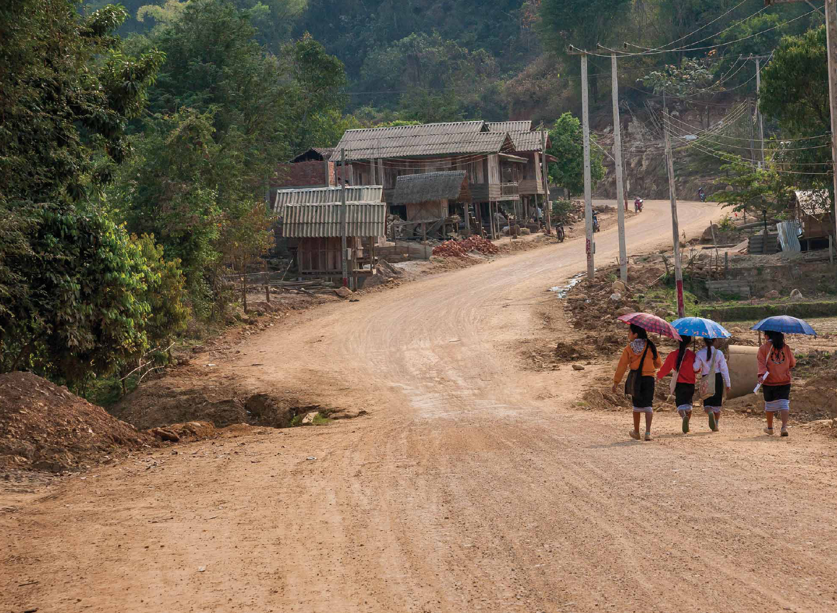 The main road as it climbs over the hill into Xam Tai village A sign - photo 4