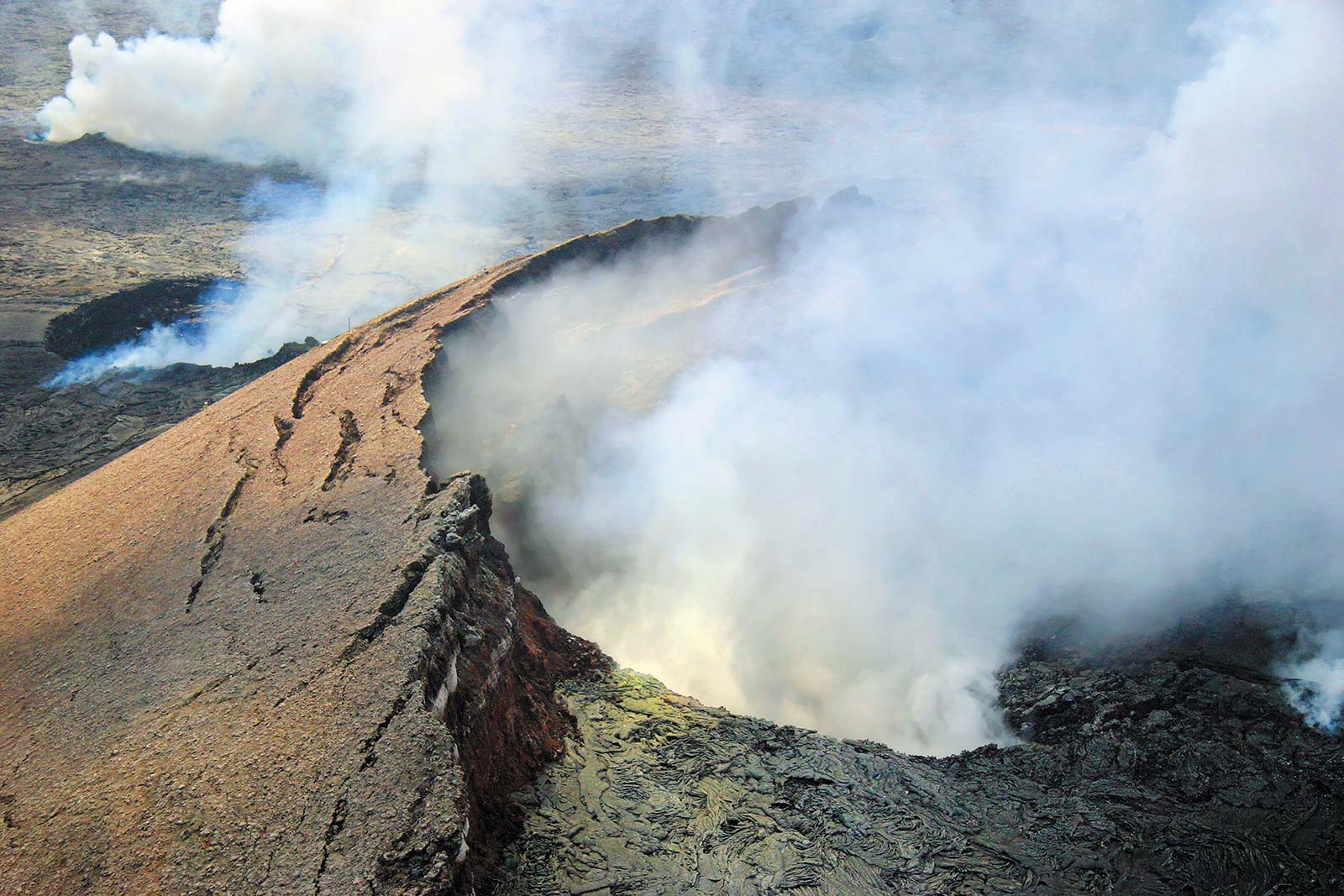 SEE VOLCANIC ISLAND-BUILDING AT a Newly active Kilauea spews lava into the - photo 6