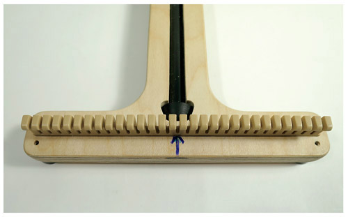 Measure the width of the loom slightly past the pegs and the height of the - photo 2