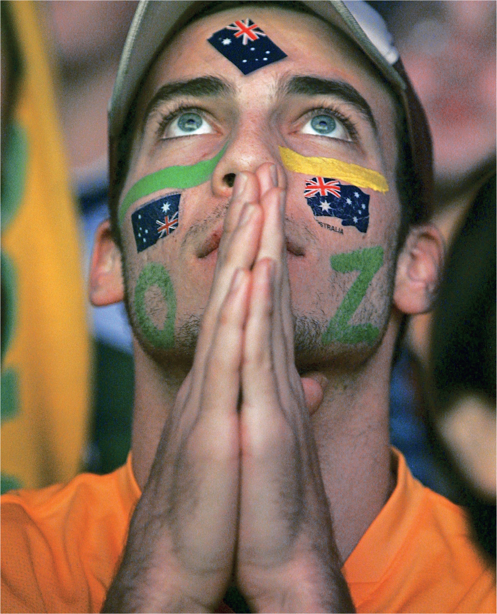 An Australian fan appears to pray for divine intervention during a public - photo 4