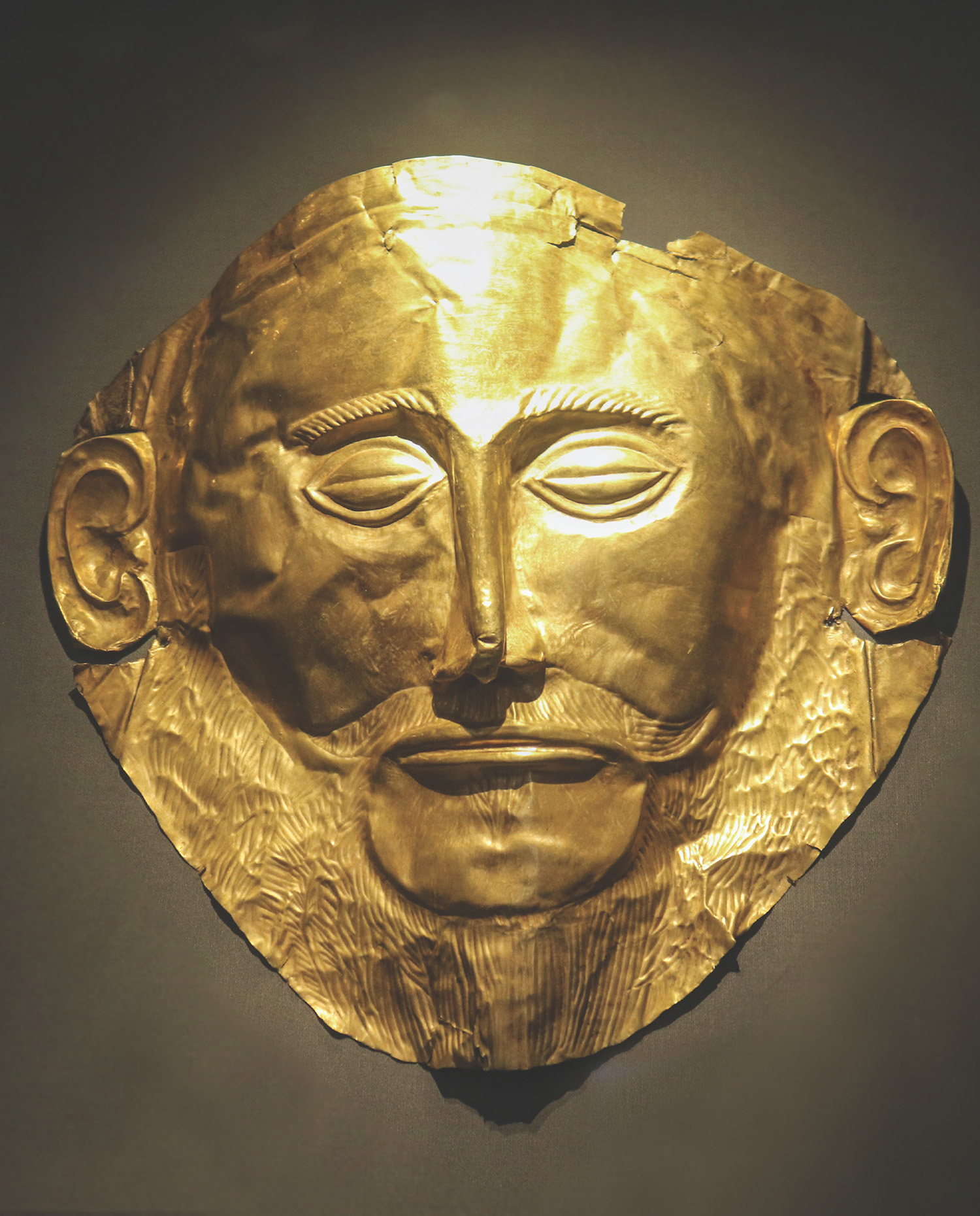 The so-called Mask of Agamemnon the famous gold funeral mask found in the - photo 5