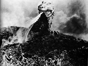 Godzilla shoots fire as the field workers flee for their lives A ship took - photo 11